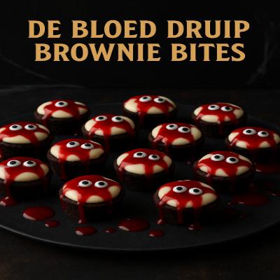De BloedDruip Browniebites – kleine brownies met rode topping, griezelige Halloween traktatie.